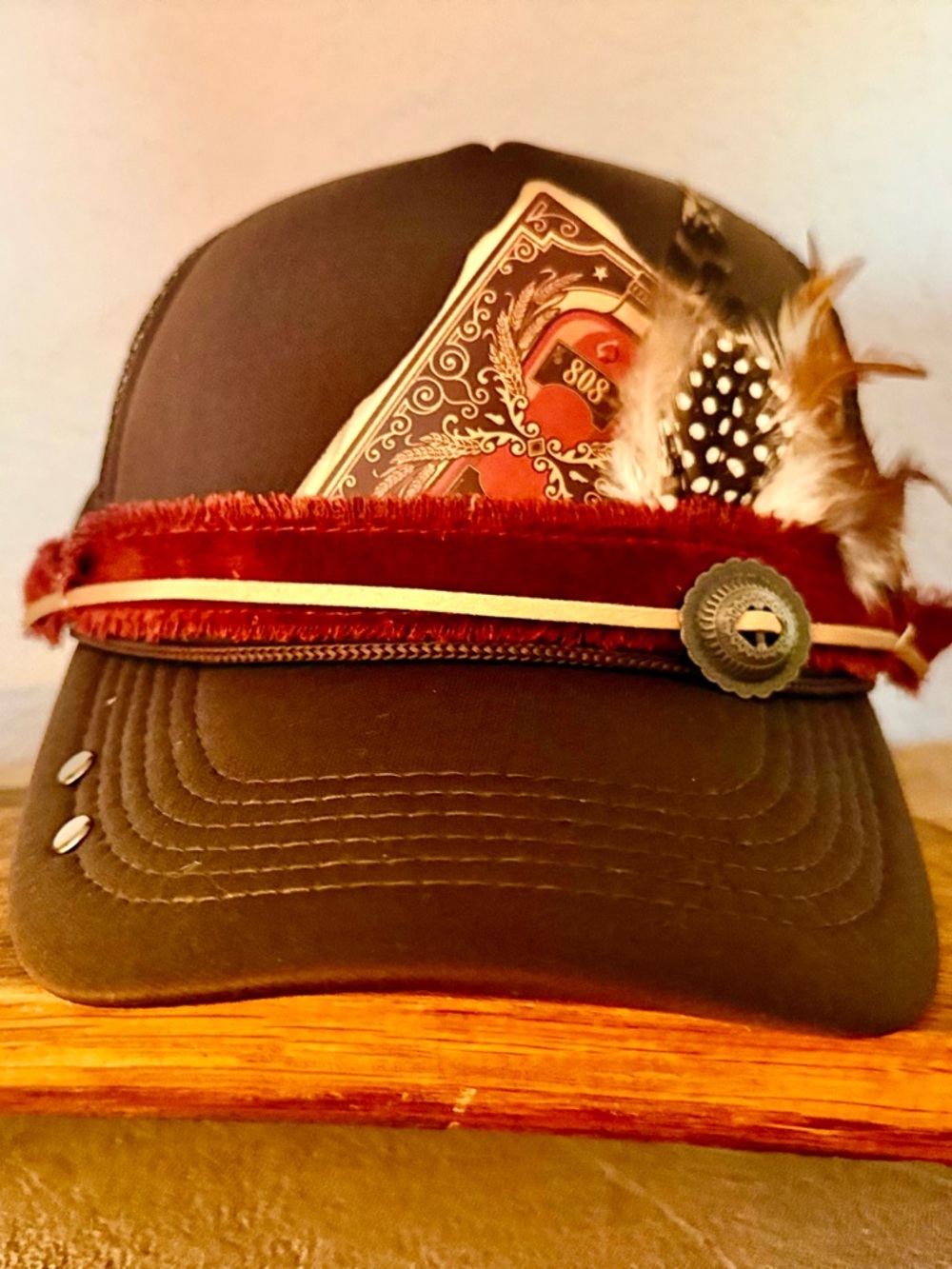 Brown Trucker Hat with Velvet Band and Feather Accent